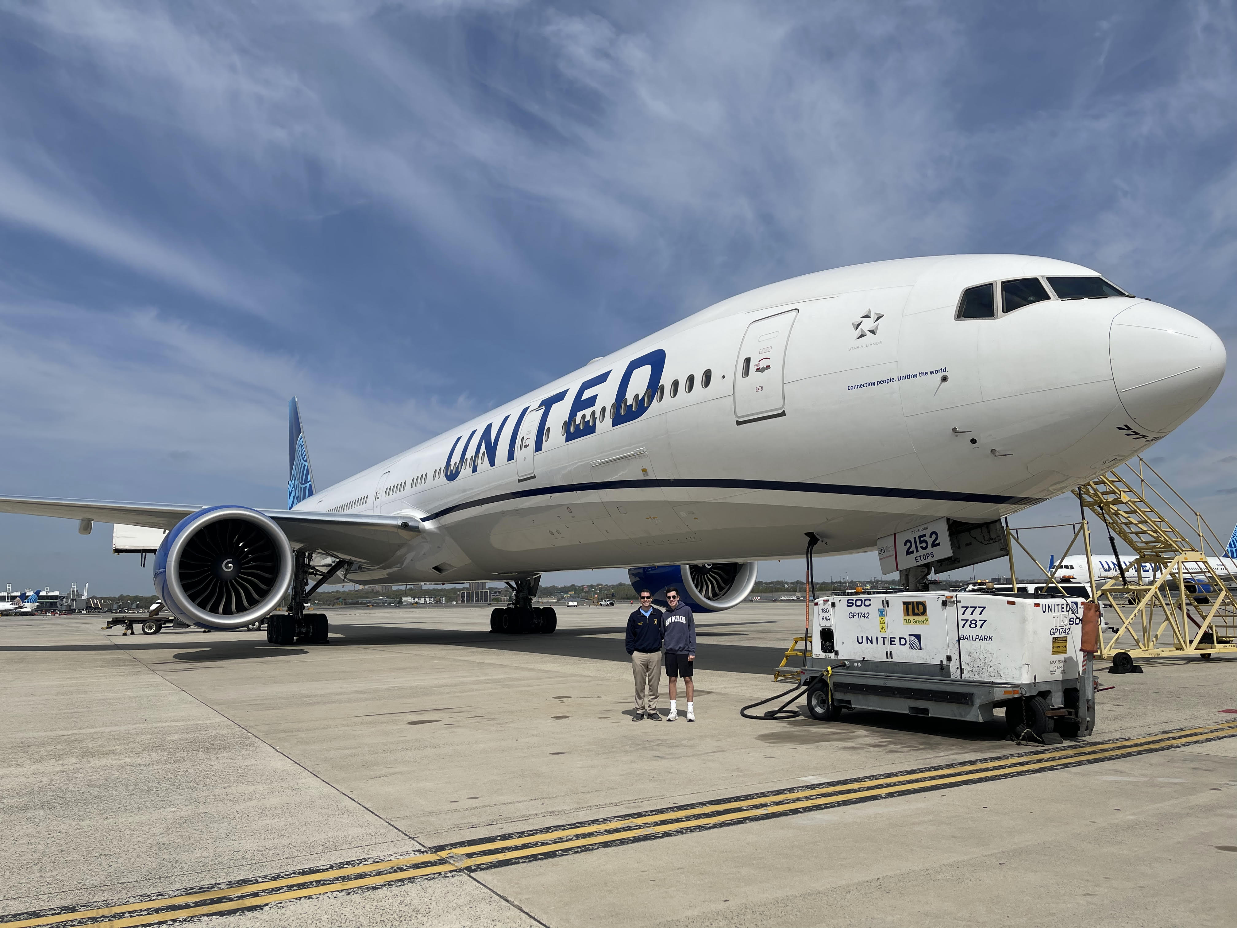 RHS Student and teacher in front of an United airplane in Newark during a private tour